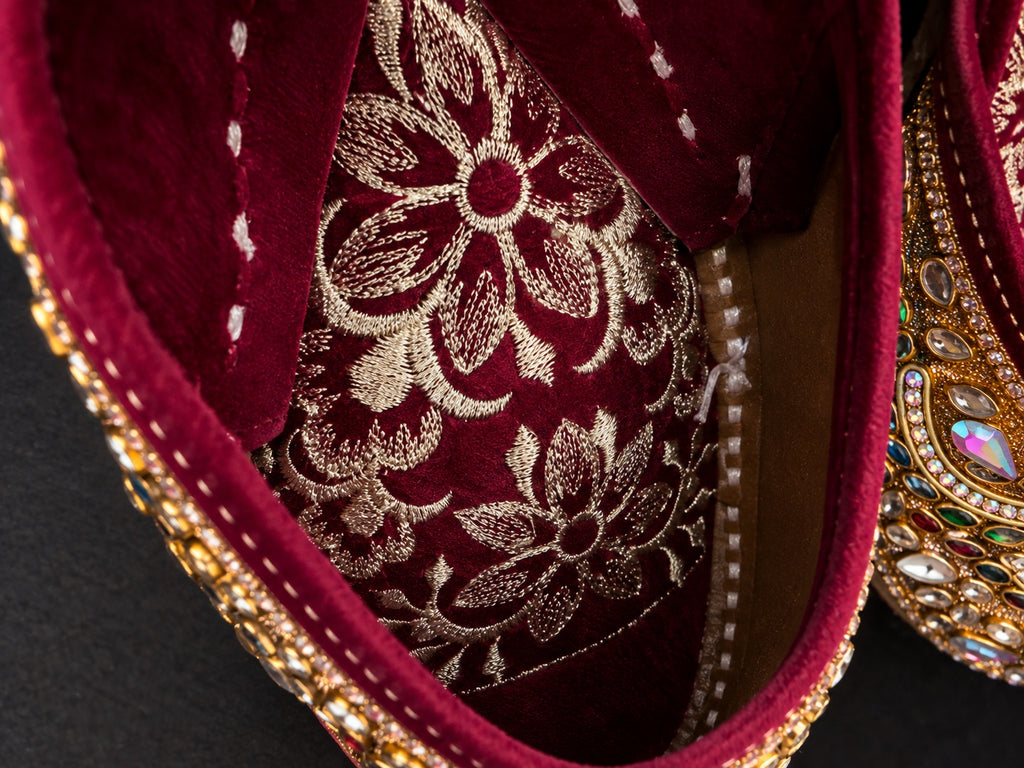 Burgundy and gold embellished Punjabi juttis - styled view